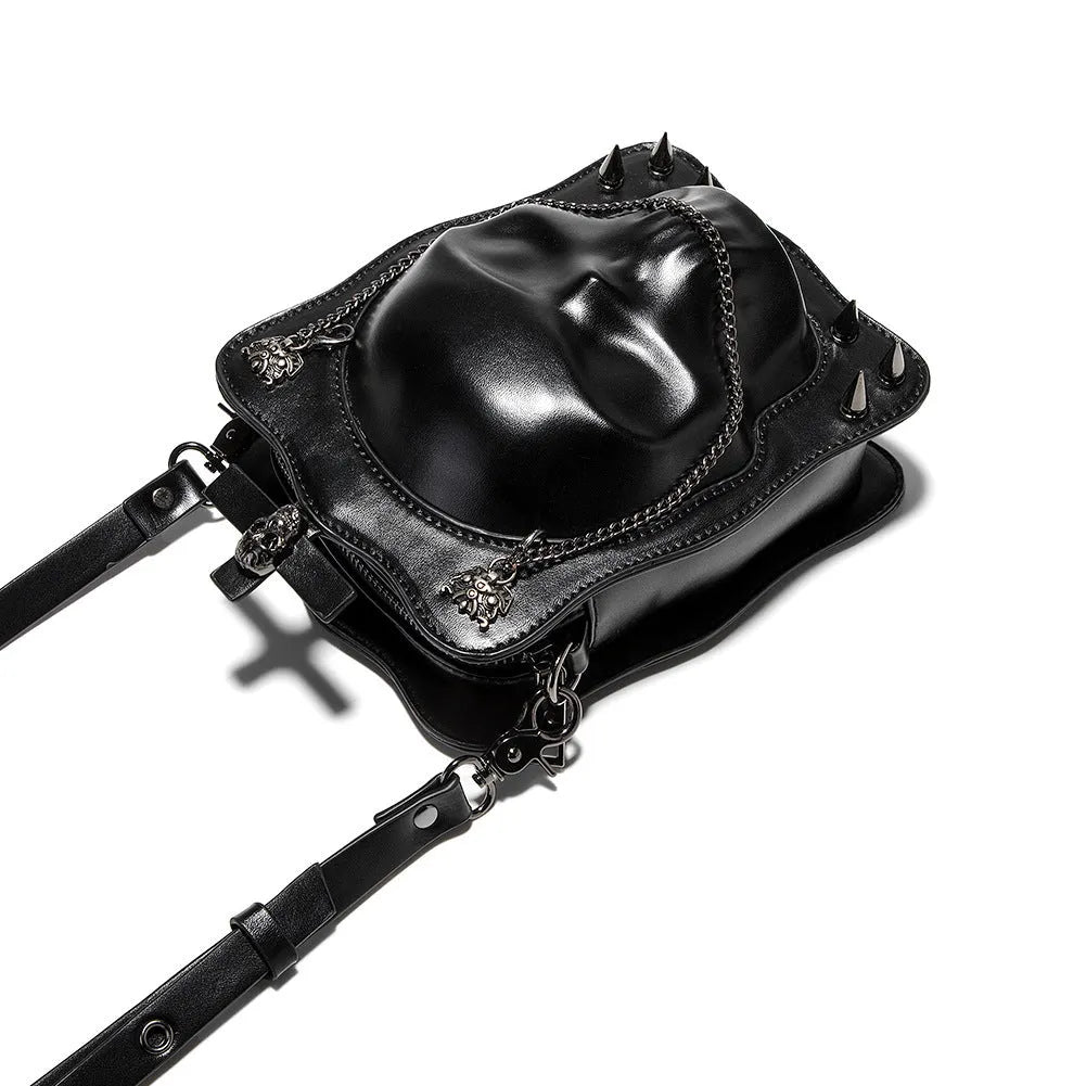 Black mini square crossbody bag with 3D embossed skull design, stitching, and chain detailing