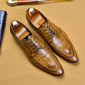Men's black leather shoes with alligator pattern texture and a silver horse bit buckle on the front.