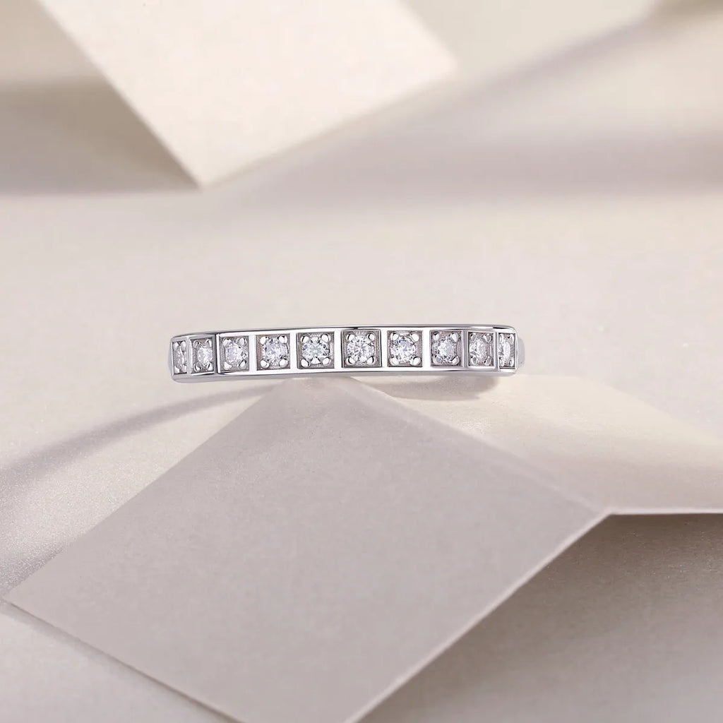 Moissanite wedding ring set on white background, S925 silver platinum plated, less than 0.1 carat stone
