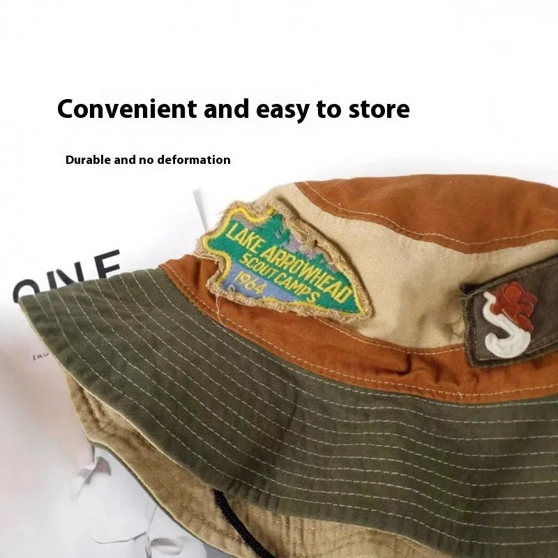 Army green cotton women's fisherman hat with flat top crown and hand-painted patchwork design