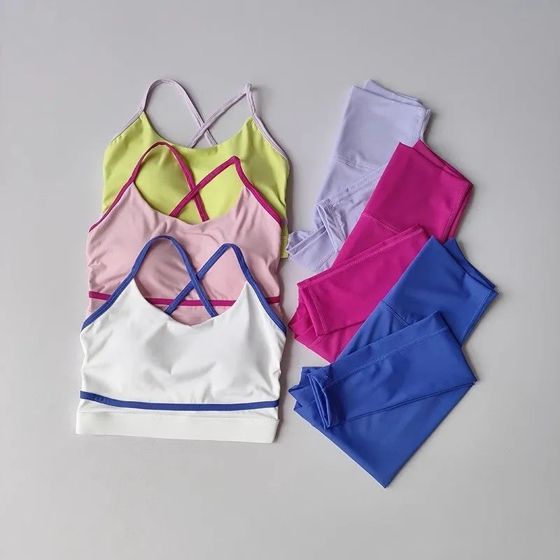 Women's blue and white nylon spandex sleeveless tank top and cropped yoga pants set.