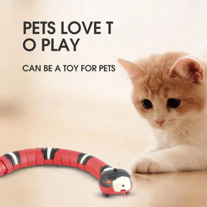 Interactive electric induction snake cat toy with S-shaped body, flashing eyes, and retractable tongue on a floor