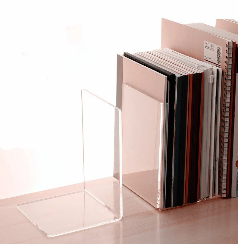 Transparent acrylic bookcase displaying textbooks on smooth-edged plexiglass shelf