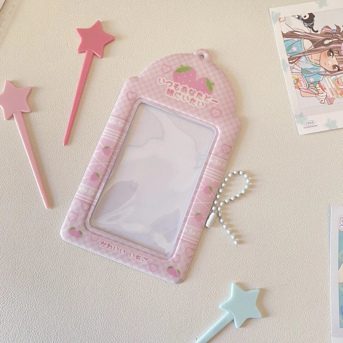 Cartoon PVC meal card holder pendant on a chain, showing strawberry and four-leaf clover design options.