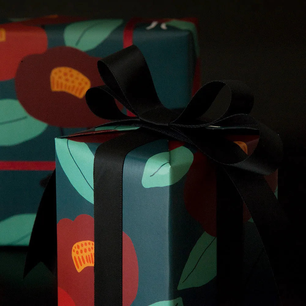 Green waterproof Christmas gift wrapping paper with Camellia design and black ribbon for gift boxes