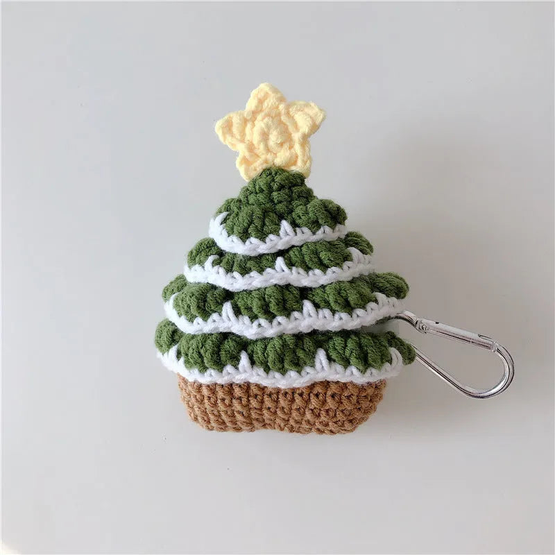 Green knitted Christmas tree flip-style headset case for AirPods with silver hook on white background