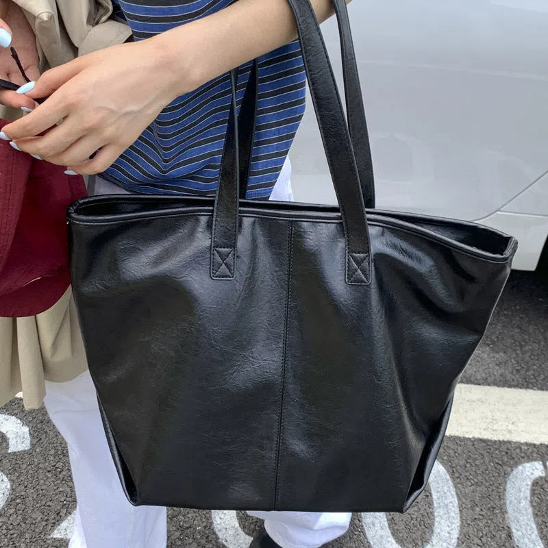 Large-capacity PU tote bag with double straps, 3D outer pocket, zip hidden pocket and phone pocket in black