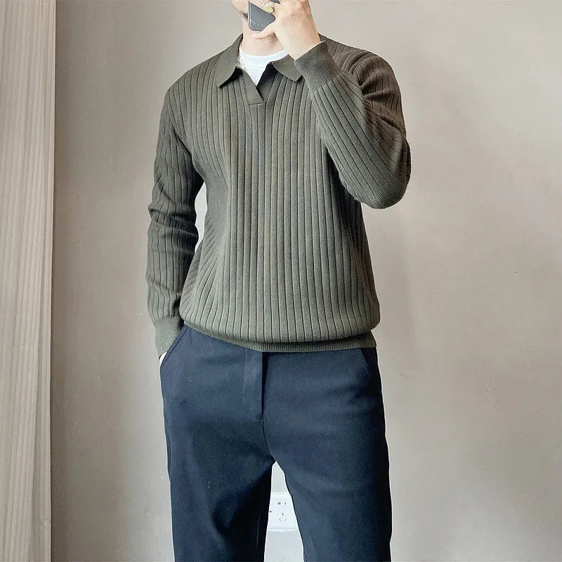 Men's loose grey knitted pullover sweater with long sleeves on a hanger.