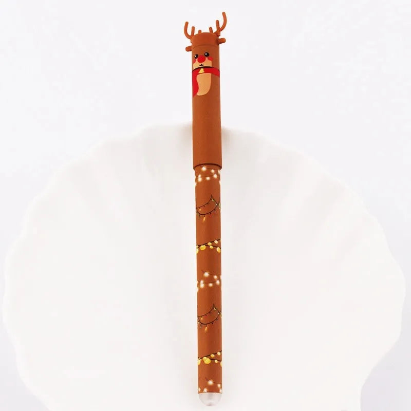 Four Christmas-themed erasable gel pens with Santa, gingerbread man, elk, and snowman designs on a white background