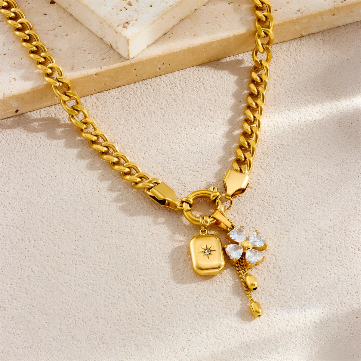 Tassel stainless steel bracelet and necklace set with flower and butterfly motifs for women