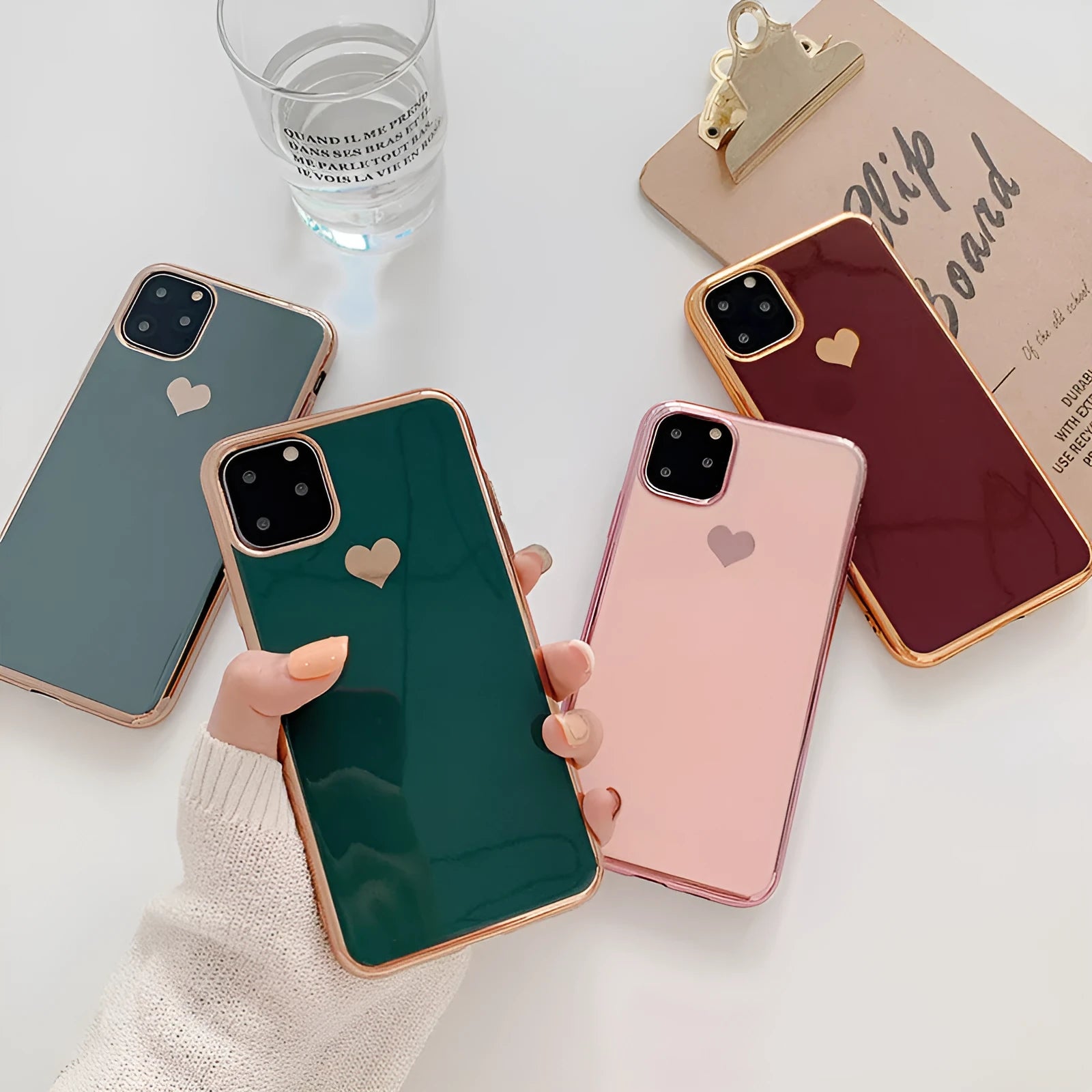 Solid colour TPU back cover phone case for iPhone, shown in blue, claret, pink, or green.