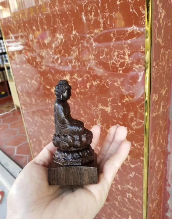 Natural black wood carving of Sakyamuni Buddha, 30cm tall, seated ornament for home or office