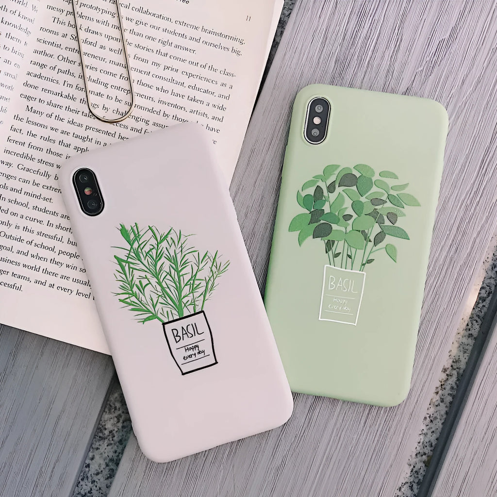 White silicone iPhone case with detailed green painted plant leaves design on the back.