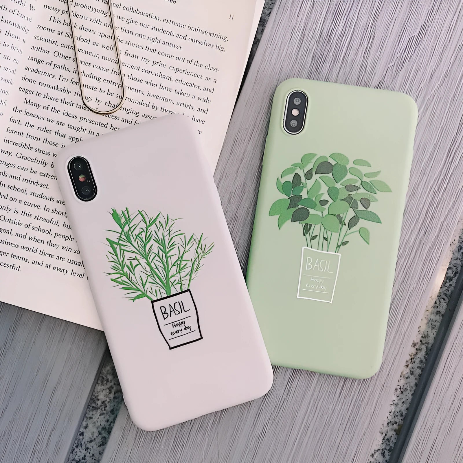 White silicone iPhone case with detailed green painted plant leaves design on the back.