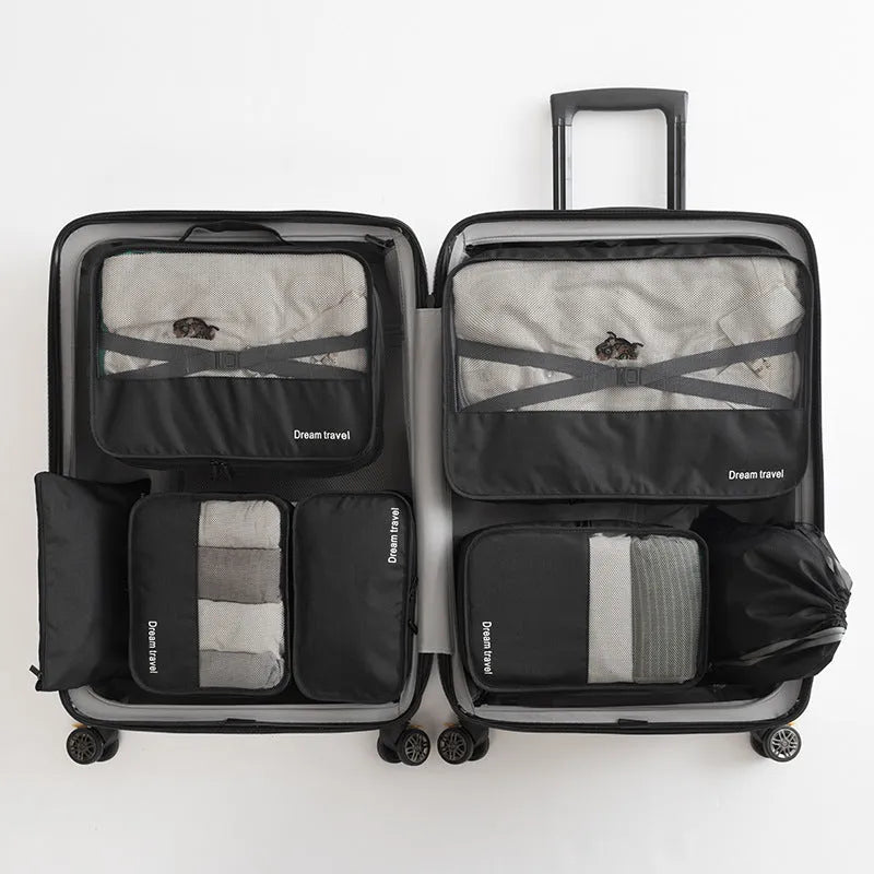 Seven-piece waterproof travel tote bag set in black and gray with six sorting bags and cation hardware