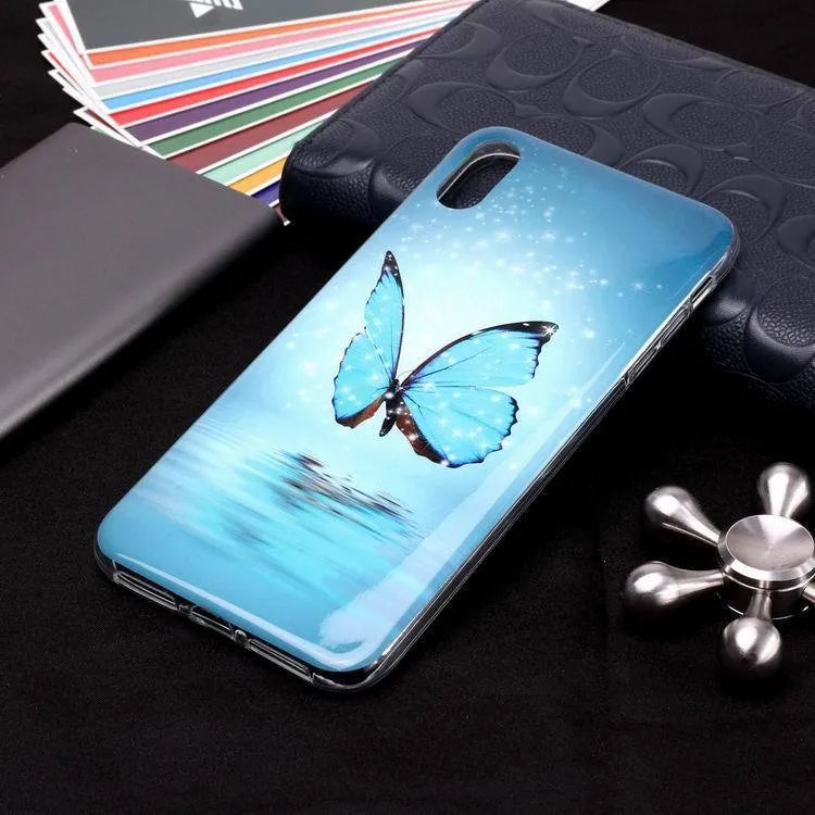 Glow in the dark iPhone case with a butterfly cartoon design on the back, showing luminous effect