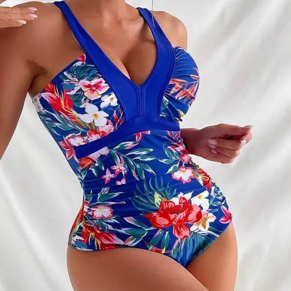 Women's black floral one-piece swimsuit with a backless design.