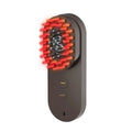Pink and black smart massage comb with red light therapy for head care, measuring under 10cm