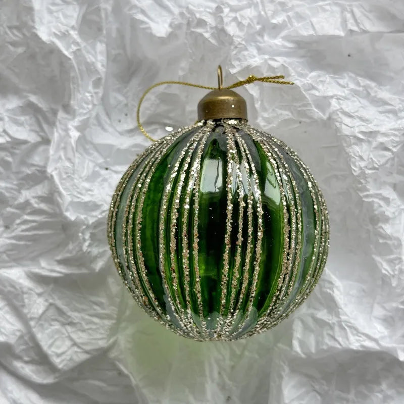 Handmade glass Christmas ball pendant 8cm in green colour hanging on tree branch