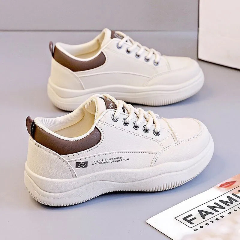 Women's white Korean-style leather pumps with cross straps and a 3-5cm mid heel on a rubber sole.