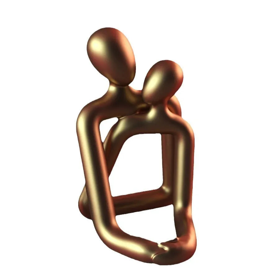 Modern minimalist resin statue of a loving couple in gold or milky white finish.