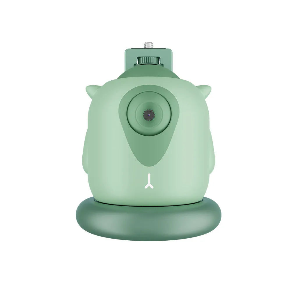 Dark green intelligent AI face tracking gimbal with 360 rotation on a desk