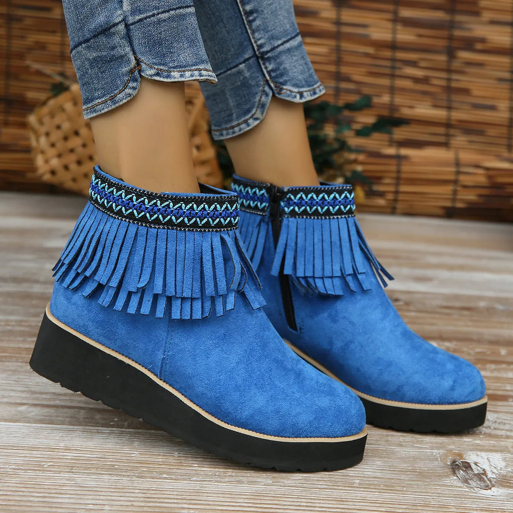 Women's suede wedge ankle boot with side zipper and tassel detail in black