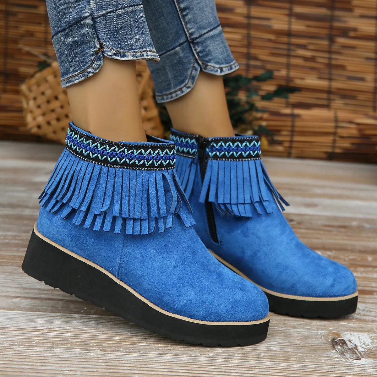Women's suede wedge ankle boot with side zipper and tassel detail in black