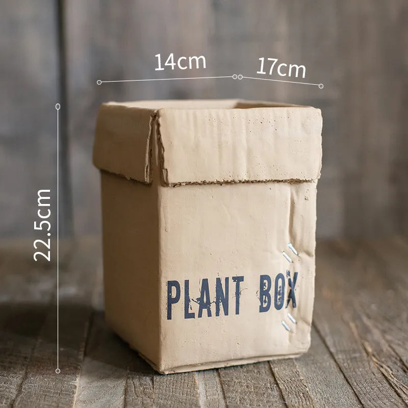 Cement brown paper box style flowerpot with bottom drainage holes for indoor planting
