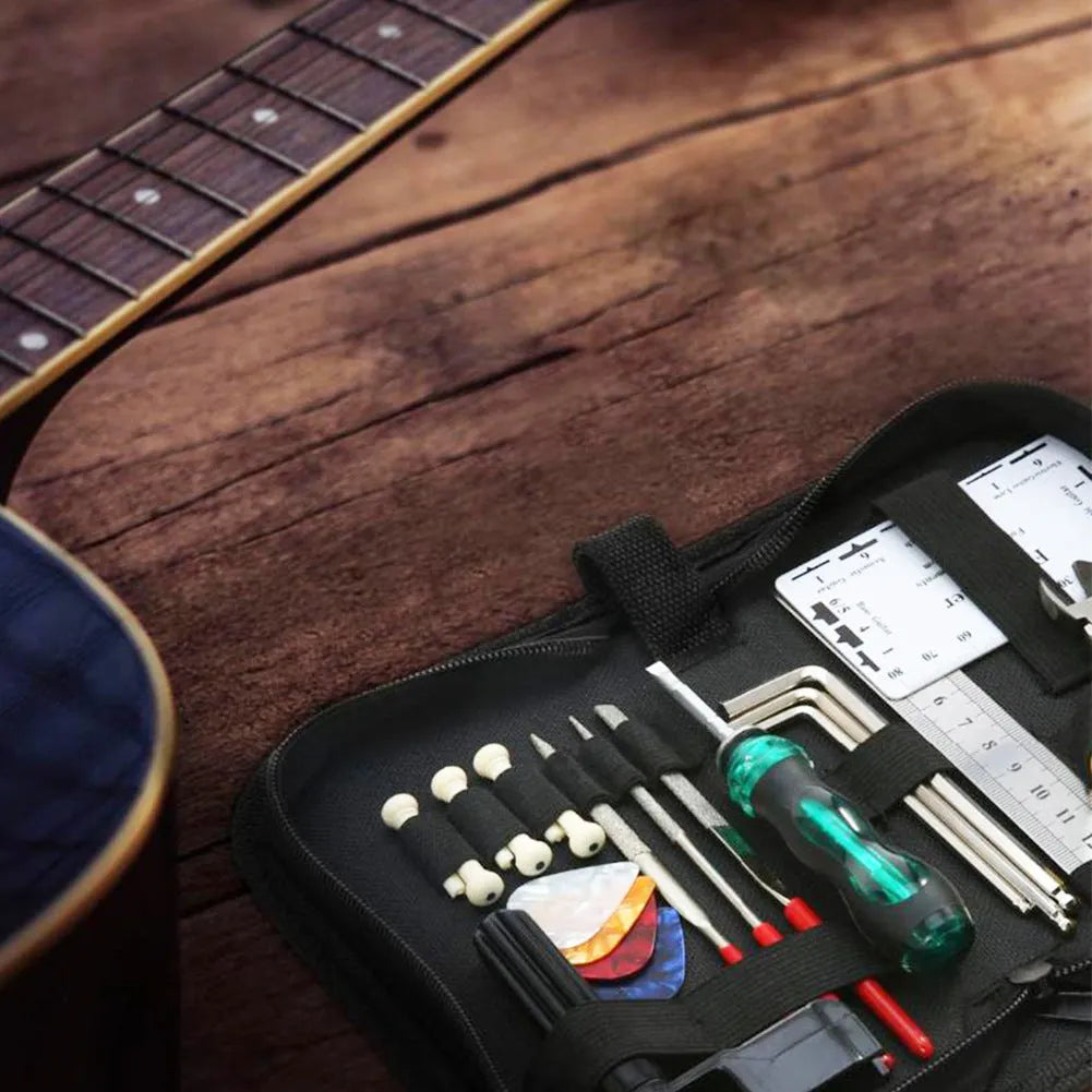 Black plastic and metal guitar repair tool kit for guitars, basses, mandolins and banjos
