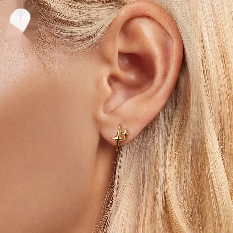 Sterling silver minimalist star ear clips with XINGX design elements and clip-on back