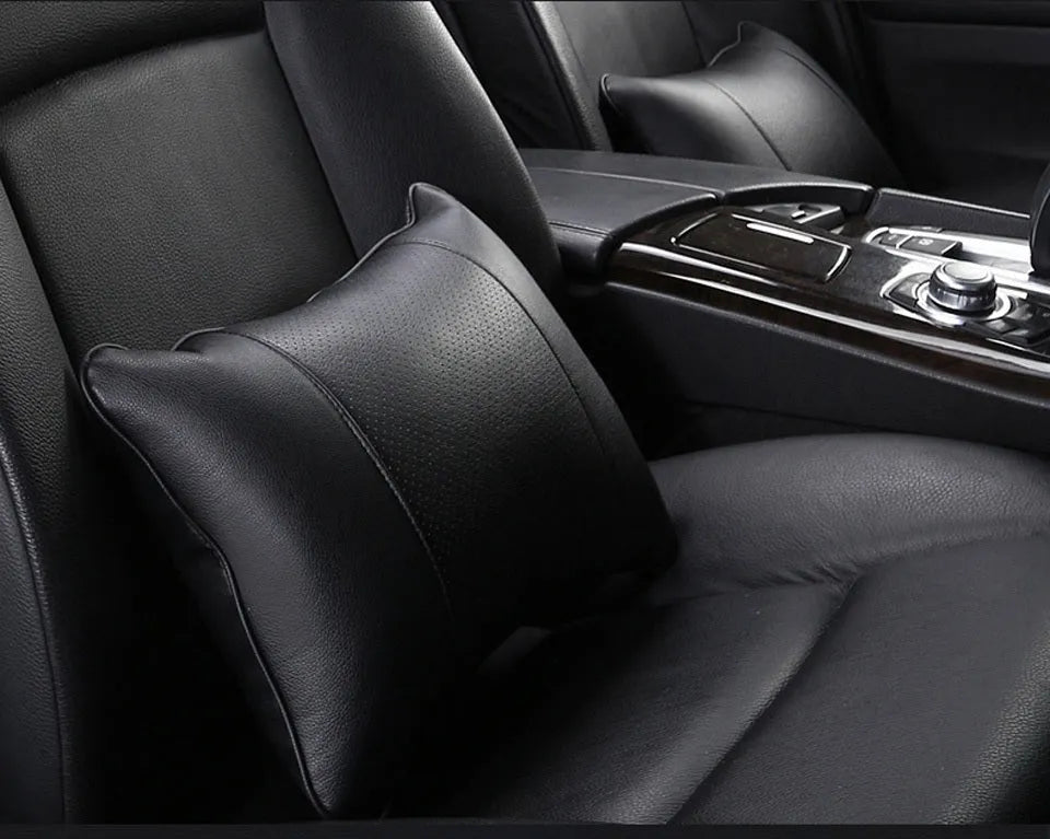 Breathable car headrest with leather cover, down yarn filling, and classic punched ventilation pattern