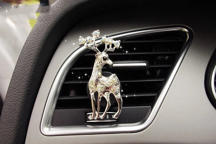 Alloy car perfume clip with liquid fruity scent attached to air vent in various cartoon styles