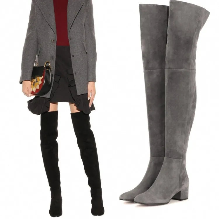 Grey suede women's flat over the knee boots with a pointed toe and low thick heel.