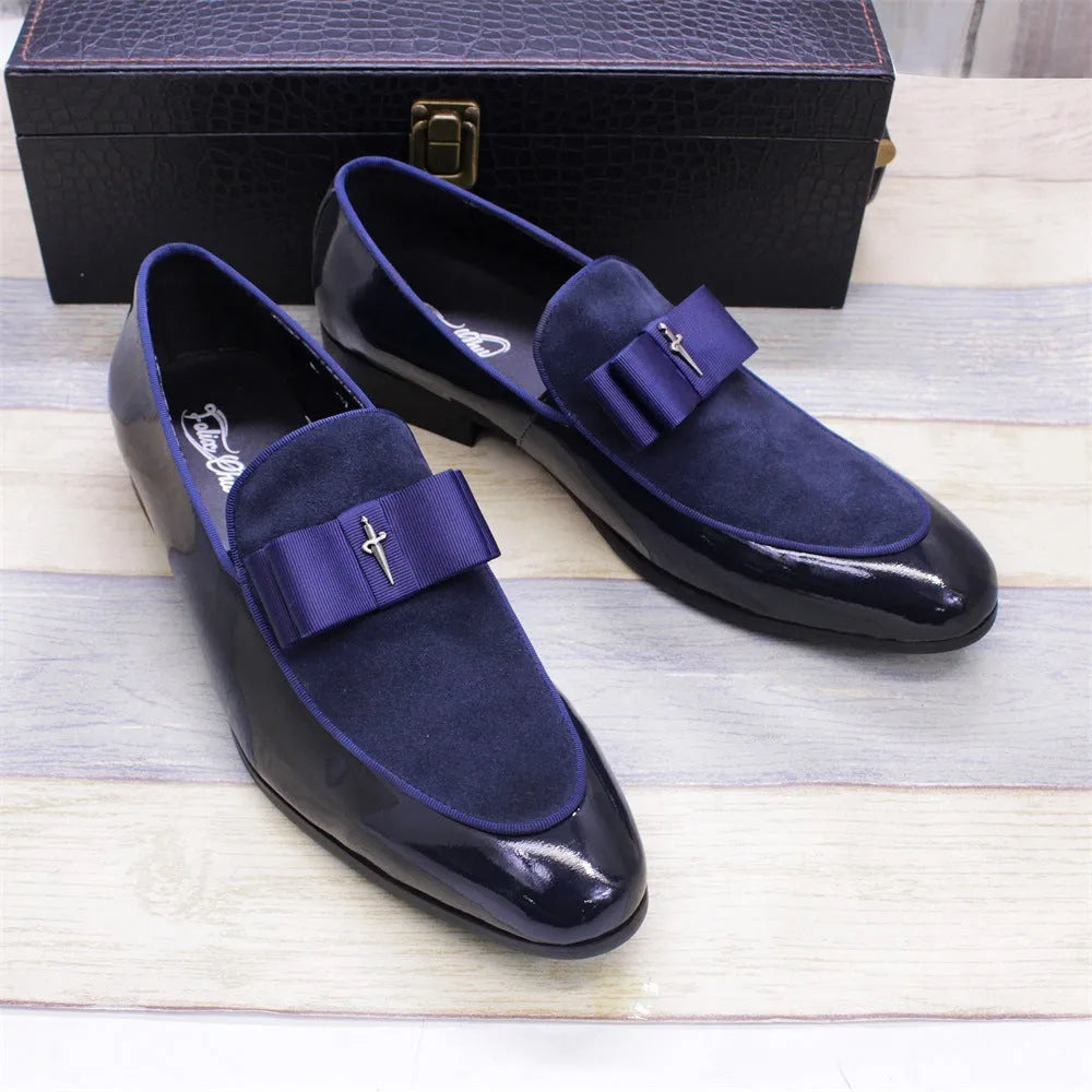 Men's glossy patent leather dress shoes with tassel detail in black, showing low-top design and leather toe holder.