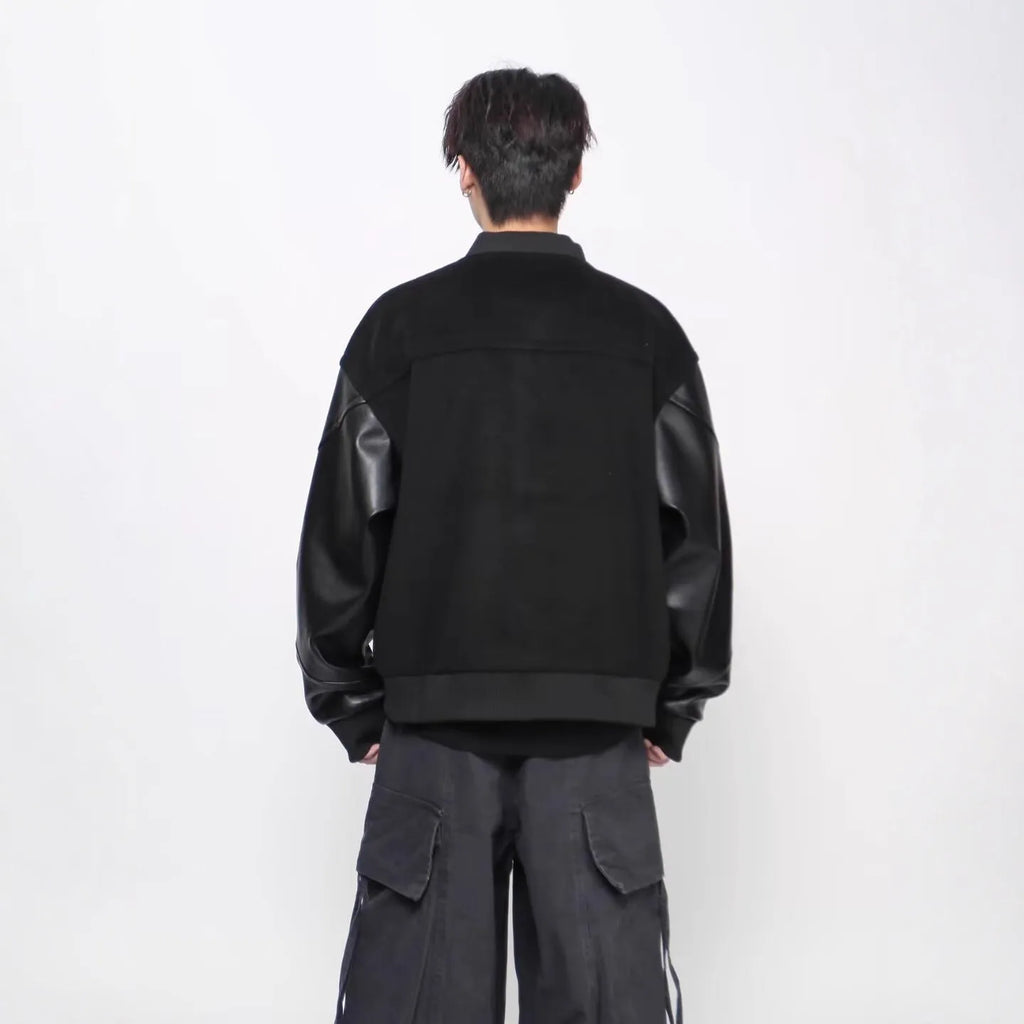 Black loose faux leather coat with longfengni patchwork, polyester lining and side seam pockets