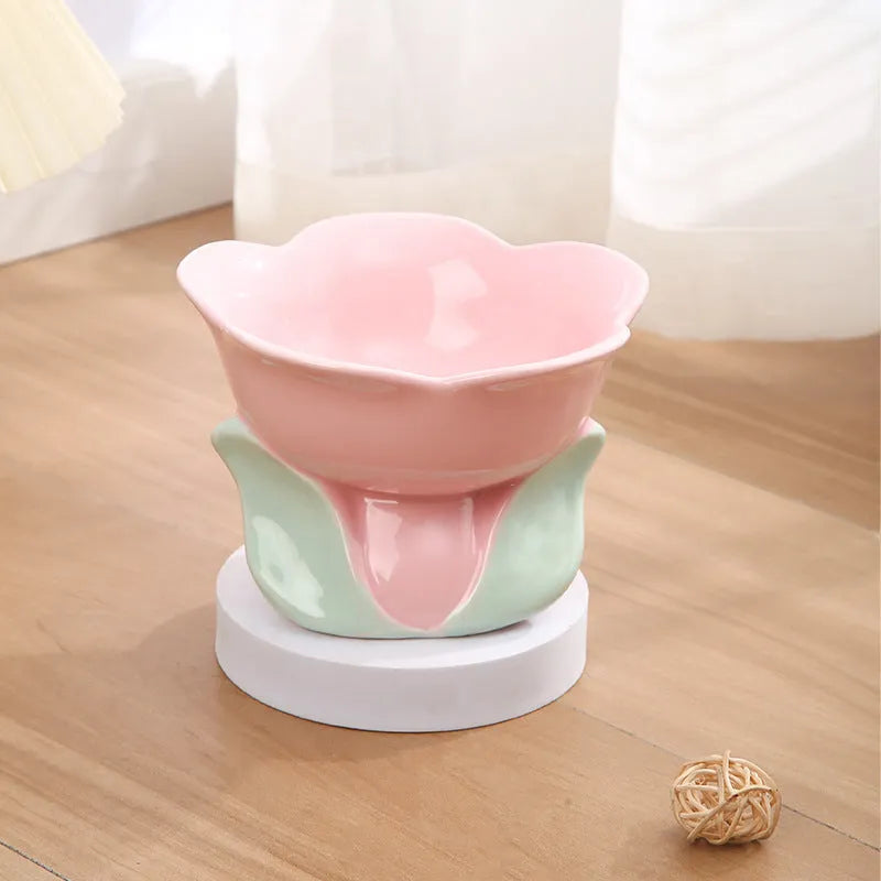 Blue ceramic elevated pet bowl with floral pattern and non-slip base for cat or small dog