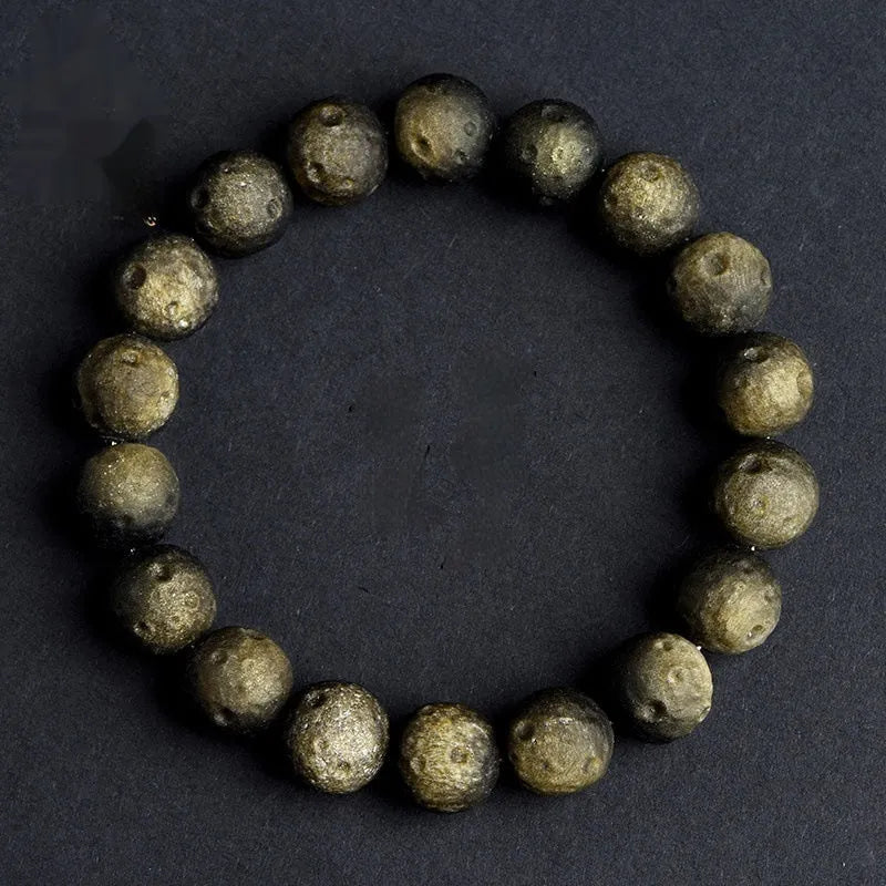 Natural obsidian crater ball bracelet with grinding texture in silver or golden meteorite colours