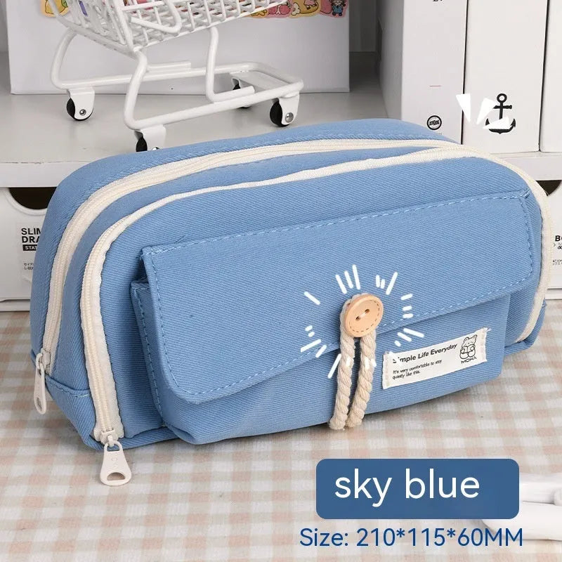 Canvas pencil case in green, beige, blue, or grey storing about 80 pens