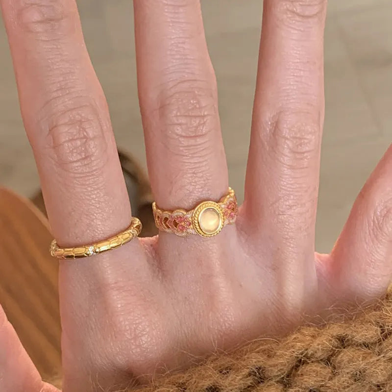 Pink crystal enamel geometric open-mouth ring on a gold-plated copper band.