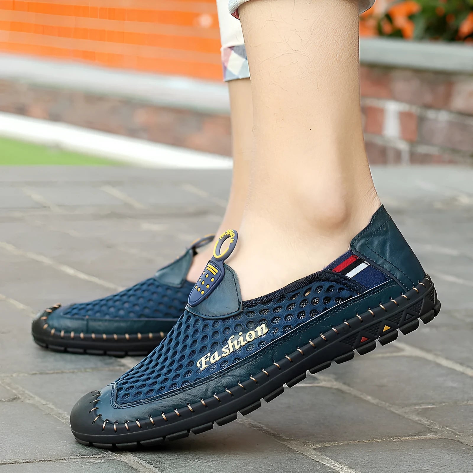Men's brown breathable mesh casual slip-on shoes with a round toe and rubber sole on a white background.