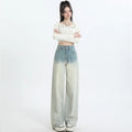 Women's gradient blue straight-leg denim trousers showing colour gradation effect and contemporary cut