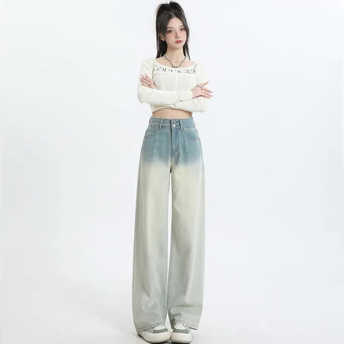 Women's gradient blue straight-leg denim trousers showing colour gradation effect and contemporary cut