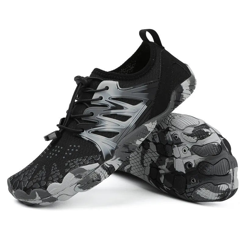 A pair of quick-drying lace-up beach shoes in a mesh material with a rubber non-slip sole.