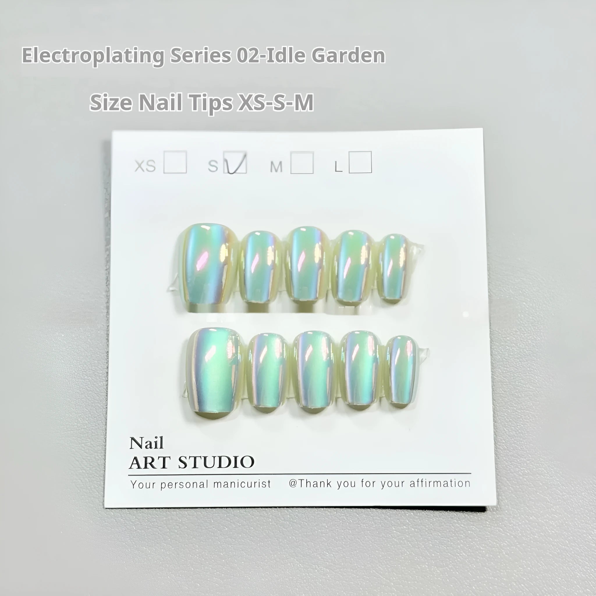 Electroplated Cat's Eye artificial nail set with Aurora armour finishes in short ladder sizes XS, S, M