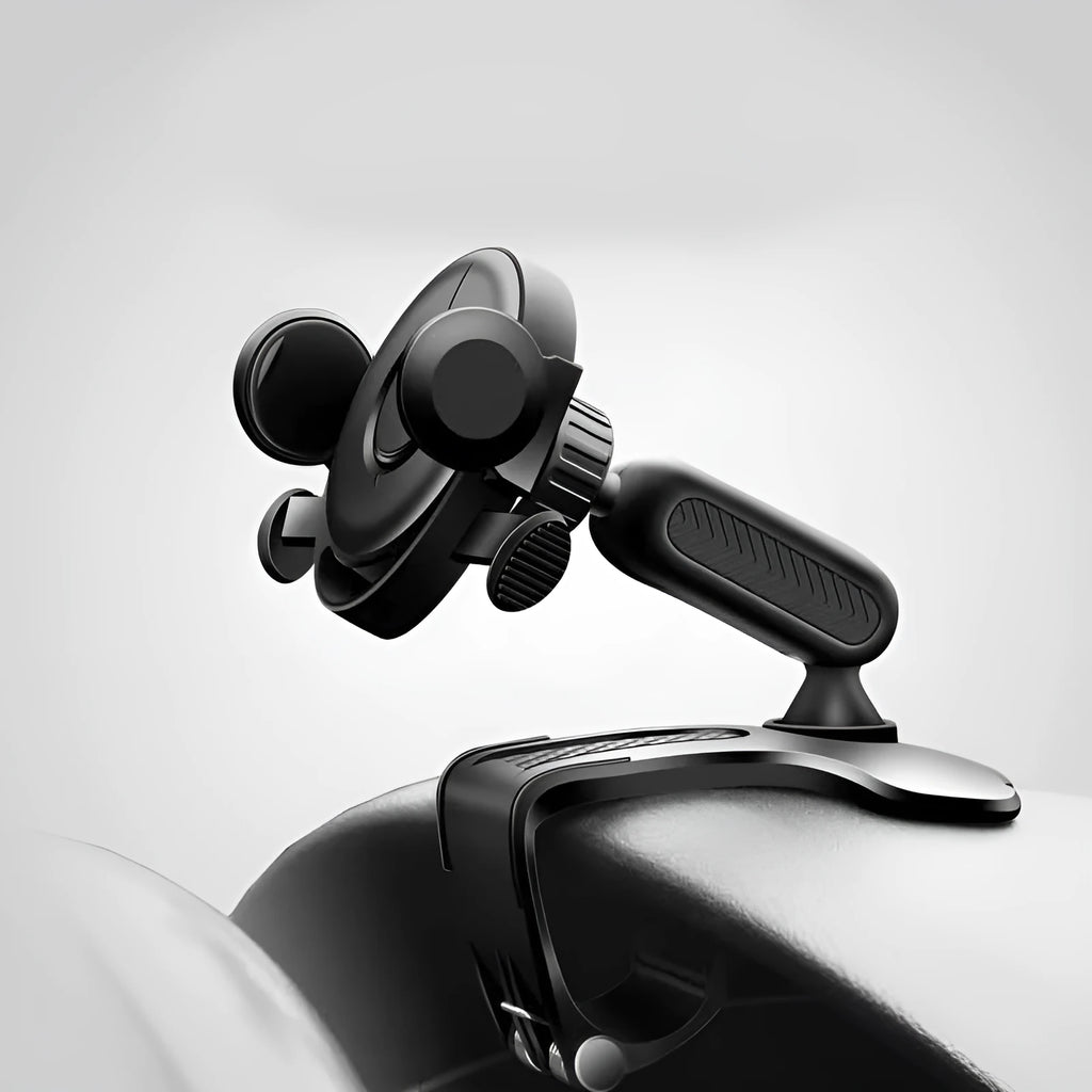 Black multifunctional car phone holder clipped onto a car sun visor, holding a smartphone.