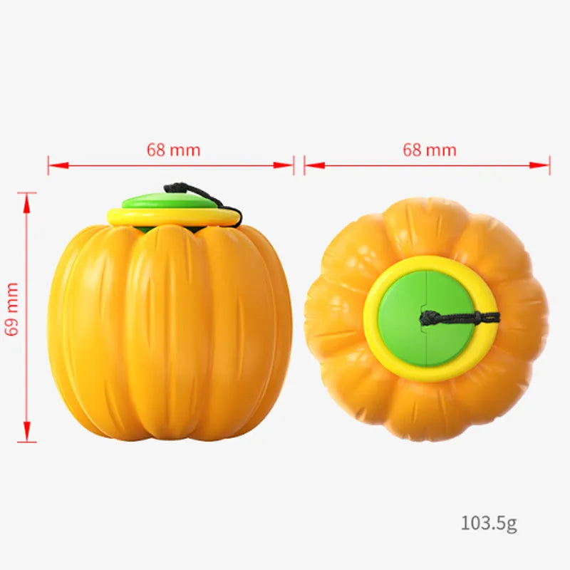 Orange pumpkin-shaped dog chew toy with squeaker for small dogs on green background