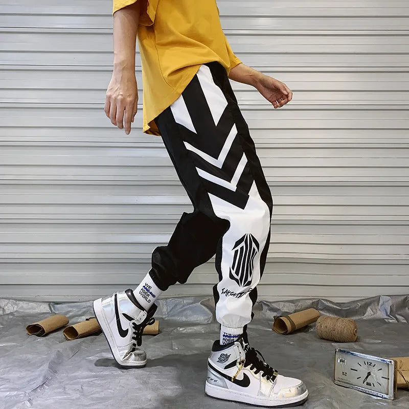Mens hiphop tapered trousers in black acetate fibre with small-foot opening side view