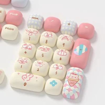 Sublimation printed cartoon pig party theme mechanical keyboard keycap set in multiple colours on a keyboard.