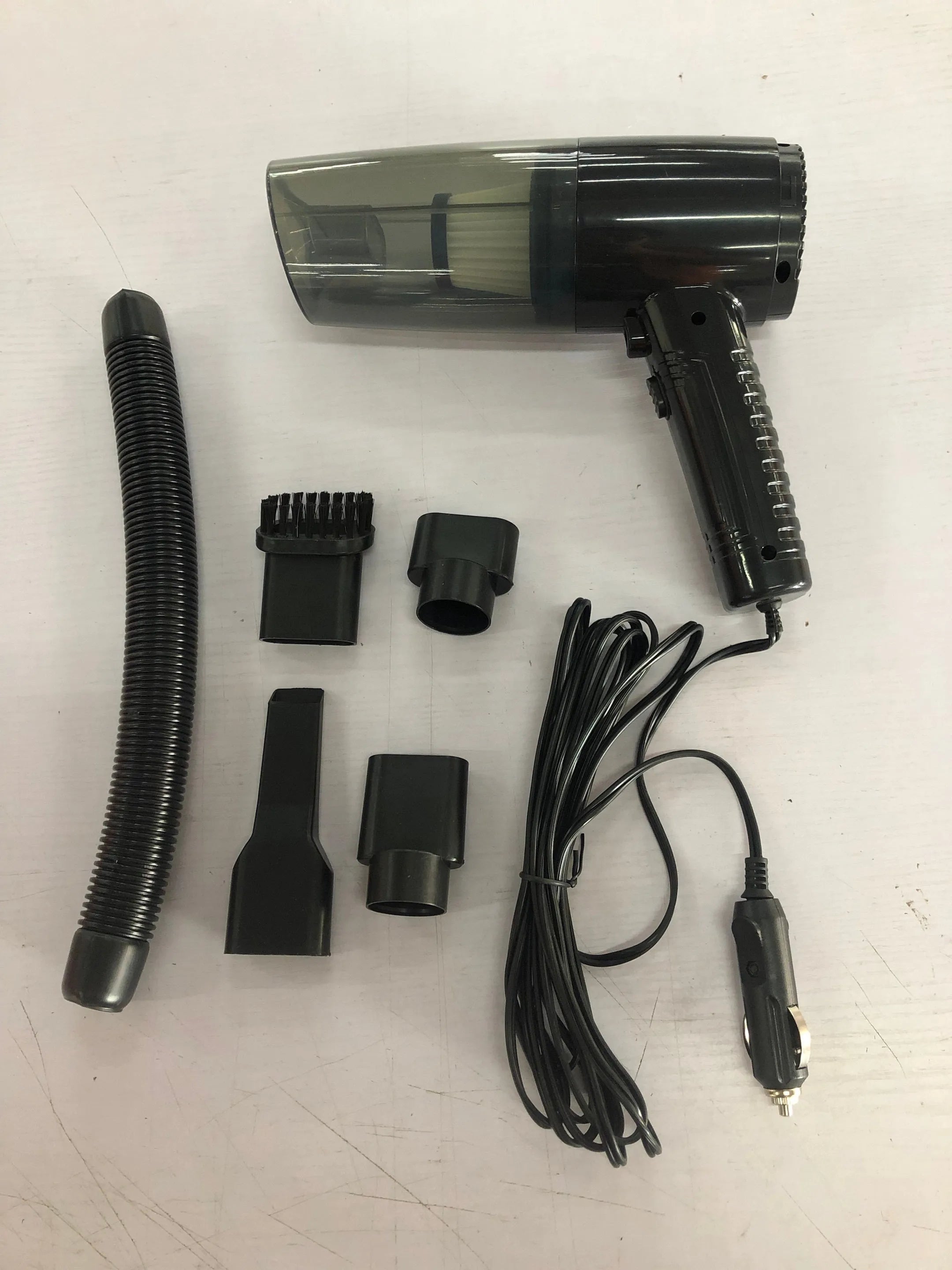 Dual-purpose car vacuum cleaner with accessories in black or white colour options